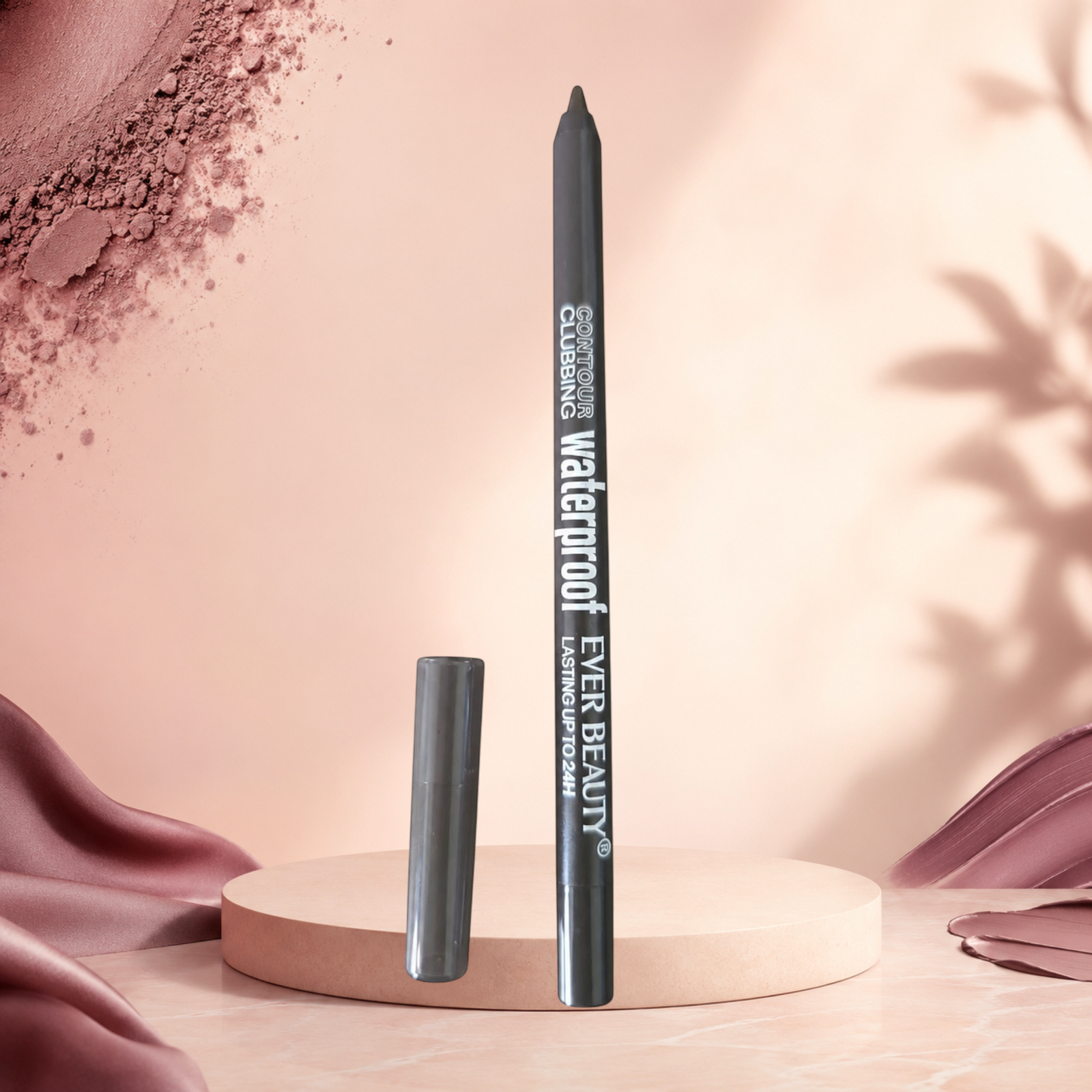 Marom EVER BEAUTY waterproof eye contour pencil in dark grey with a matching cap on a circular pedestal