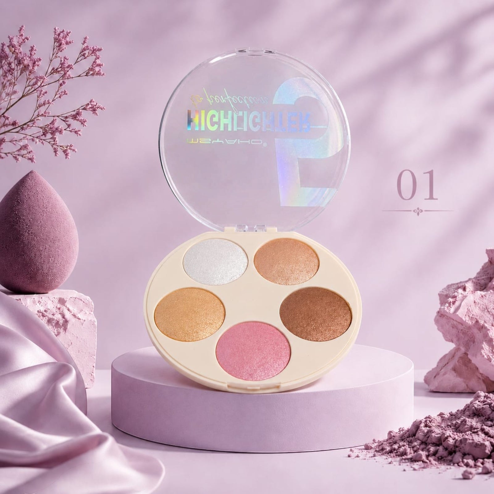 Marom Msyaho Highlighter Perfection palette with five shimmering shades in a round compact on a purple pedestal.