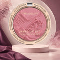 Marom MSYAHO baked powder makeup palette in a shimmering pink shade with embossed floral design on a pedestal